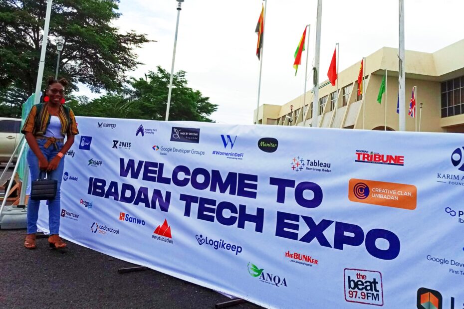 Slvr wlf staff standing in front of the Ibadan tech expo banner